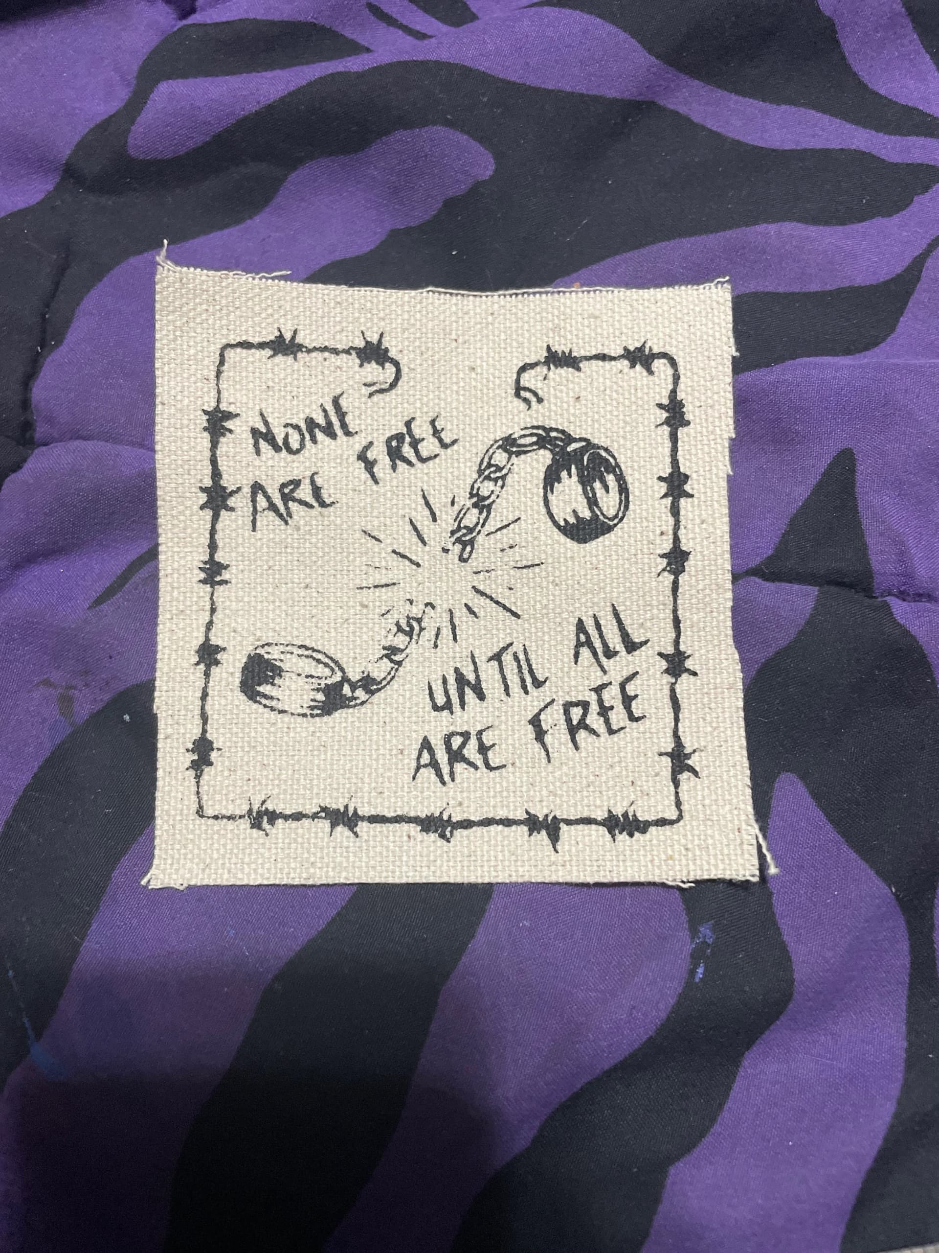 None Are Free Until All Are Free Patch! - Image 1
