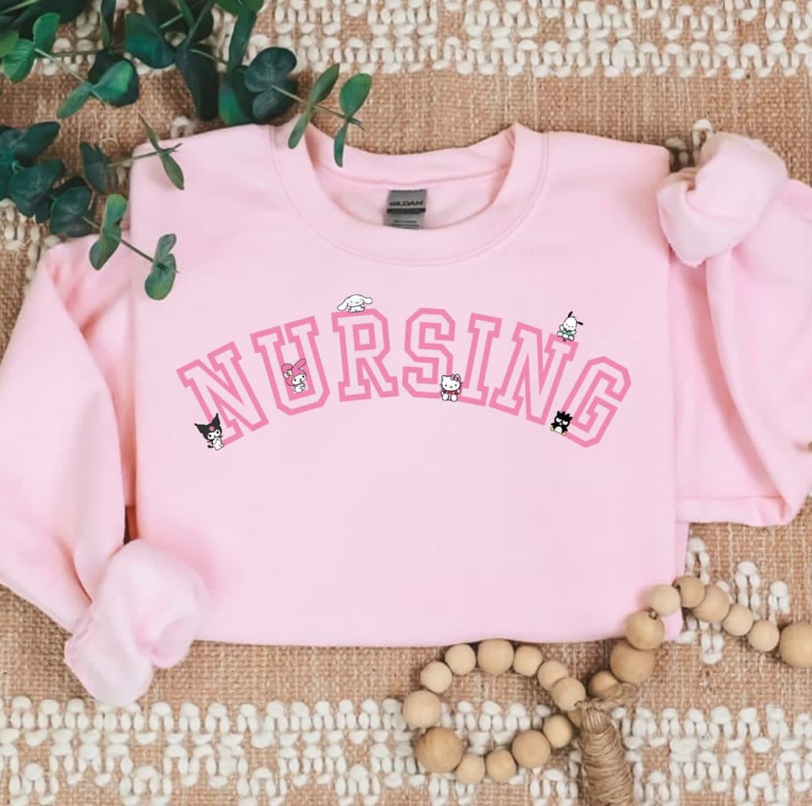 PINK NURSING Kawaii Characters Cozy Sweater - Image 1