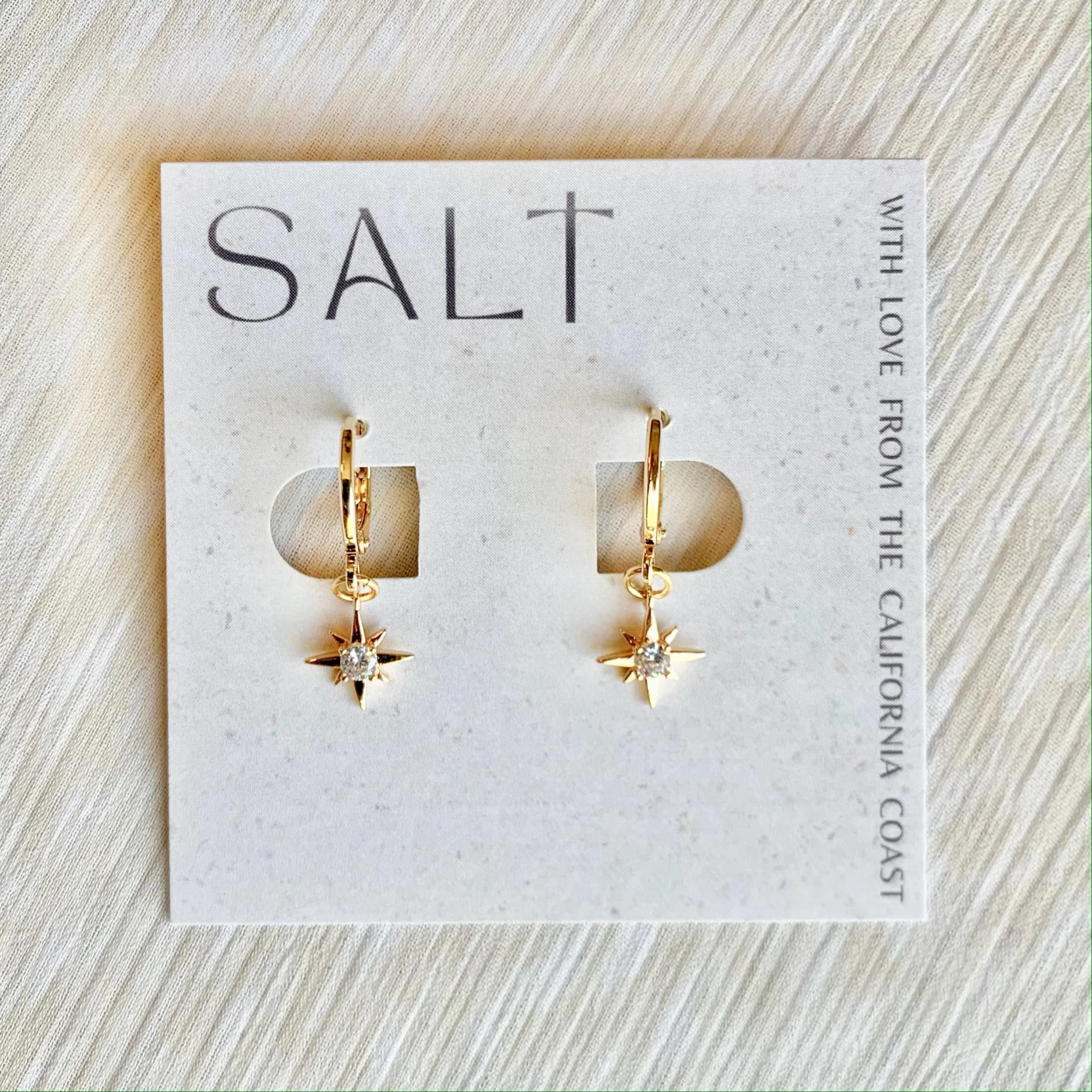 STARBURST HUGGIE HOOPS | gold star earrings | dainty jewelry | celestial chic | charm hoops | whimsical - Image 1