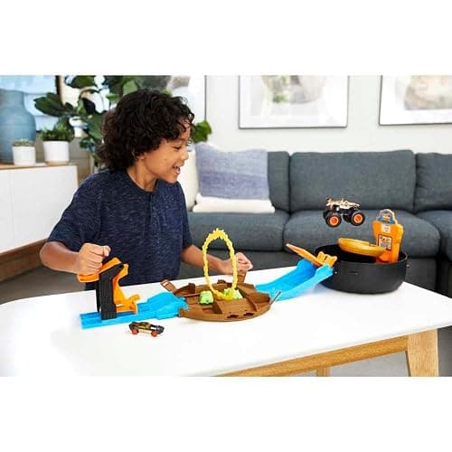 Hot Wheels Toy Monster Trucks Playset, Tire-Shaped Case Transforms into Race Course, 3 Trucks & 4 Cars in 1:64 Scale, Stunt Tire (Amazon Exclusive) thumbnail 2
