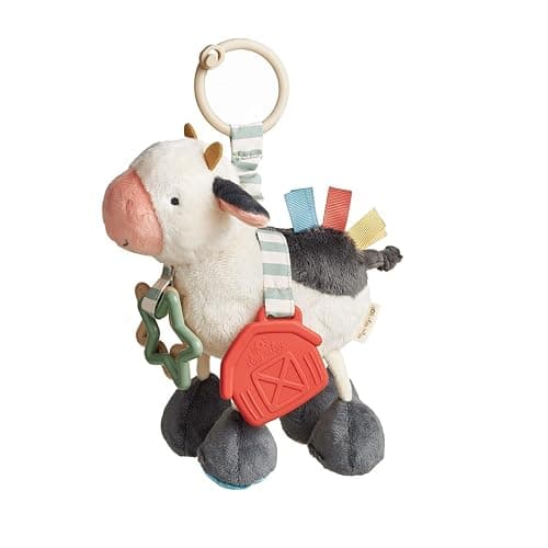 Itzy Ritzy Link & Love Toy for Stroller or Car Seat – Features Textured Ribbons, Crinkle Sounds, Clinking Rings & Silicone Teether – Designed for Ages 0 Months and Up (Cow) - Image 1