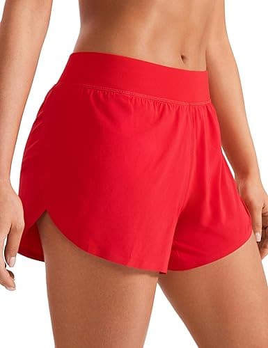 CRZ YOGA Mid Waisted Dolphin Athletic Shorts for Women 4" Lightweight High Split for Gym Workout with Liner Quick Dry - Medium - Deep Red