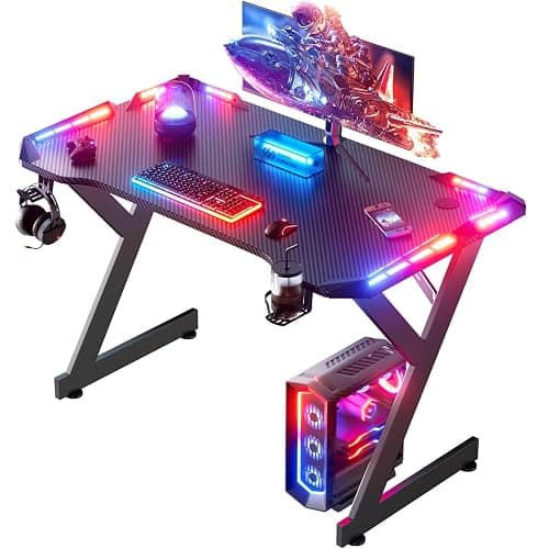 HLDIRECT 40 INCH Gaming Desk with LED Lights, Home Office Gamer Desk, Ergonomic Computer Table with Large Carbon Fiber Desktop, Office Workstation, Cup Holder & Headphone Hook, Black - Image 1