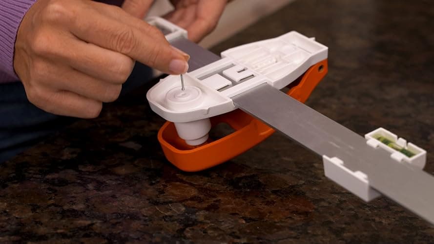 Hang Hero - All in One Picture Hanging System! Measures Frame, Levels and Inserts Nails at The Perfect Depth and Angle. Includes Hang Hero Unit and (50) #17 Brad Nails! thumbnail 4