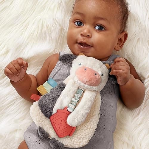 Itzy Ritzy - Itzy Lovey Including Teether - Baby Lovey with Teether, Textured Ribbons & Dangle Arms - Features Crinkle Sound, Sherpa Fabric and Minky Plush (Cow) thumbnail 2