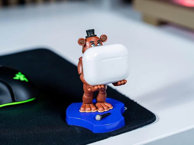 Cableguys Minis Five Nights at Freddy's Freddy Phone Stand & Earbuds Holder - Novelty Phone Stand for Desk Decor and Bedside Accessories, In Ear Headphone Holder for Smartphone & Small Devices thumbnail 2