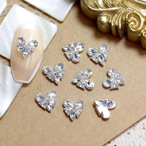 16 Stück Bunte Glitzersteine Nail Charms Nägel Zubehör Zirkon Herz Schmetterling Strasssteine Nagel Charms Nail Art Rhinestones Glitzer Steine Schleifen Herzen Nailart Edelsteine Nageldesign Nail Gems thumbnail 2