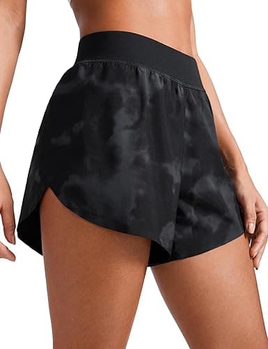 CRZ YOGA Mid Waisted Dolphin Athletic Shorts for Women 4" Lightweight High Split for Gym Workout with Liner Quick Dry - Medium - Black Tie Dye Flowers