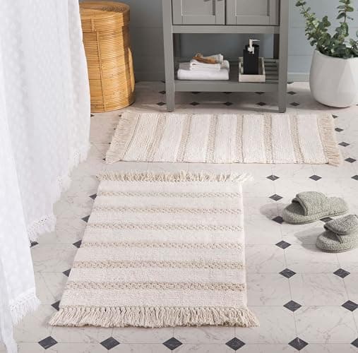 SAFAVIEH Plush Master Bath Finn Collection - 2' x 3', Ivory, Handmade Cotton, Washable & Slip Resistant, Fringe Design, Bathmat Set of 2 - Image 1