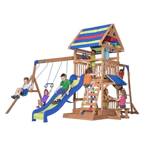 Backyard Discovery Beach Front Cedar Wood Swing Set with Wave Slide, Play Deck, Monkey Bars, Rock Wall Ladder, Shaded Picnic Area, Snack Bar, Belt Swings, Trapeze, Sandbox Area, Outdoor Playset - Image 1