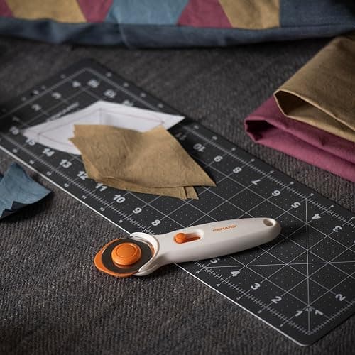 Fiskars 45mm Rotary Cutter for Fabric, Premium Steel Stick Fabric Cutter Cuts Through Multiple Layers, Right and Left Handed, Easy and Safe Blade Change, Arts and Crafts, Sewing and Quilting Tools thumbnail 2