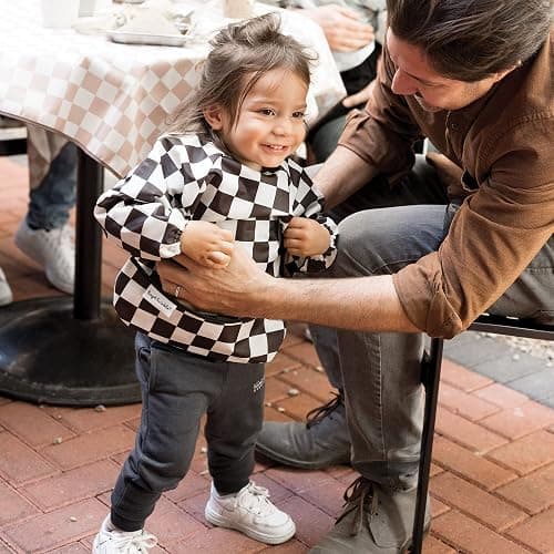 Tiny Twinkle Long Sleeve Bib for Babies & Toddlers | Waterproof Smock Bib for Eating | Machine Washable & Mess-Proof Feeding Essentials | Newborn Shower Gift (Checkers Black, 6–24M) thumbnail 2