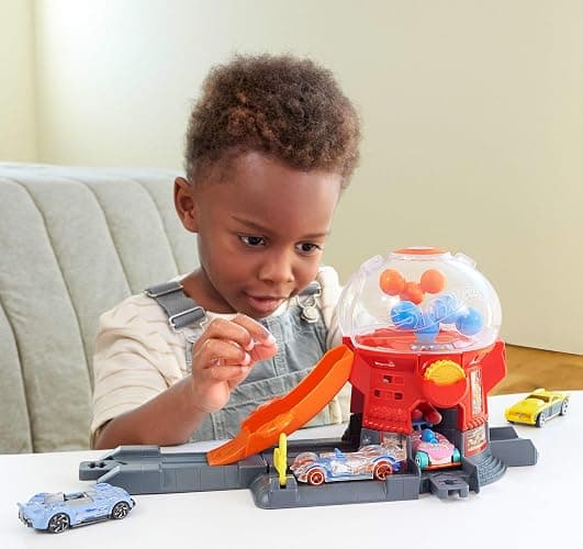 Hot Wheels Toy Car Track Set, Gumball Machine Playset with 1:64 Scale Die-Cast Donut-Shaped Vehicle & Speed Snap Track, Downtown City Candy Shop thumbnail 3