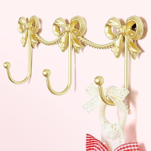 KYIAANY Gold Bow Hooks for Girls: Cute Triple Bows Hooks Wall Mount for Nursery Bedroom Bathroom for Hanging Towel Bag Robe Jewelry - Metal 3 Hooks Coquette Room Decor for Girly Daughter Kids Baby - Image 1