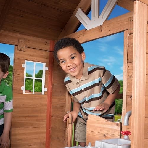 Backyard Discovery Scenic Heights Elevated Cedar Wooden Kids Playhouse with Play Kitchen, Wrap-Around Deck, Toy Storage Bench, Saloon-Style Doors, Ladder, Stairs, and Growth Chart for Outdoor Play thumbnail 5