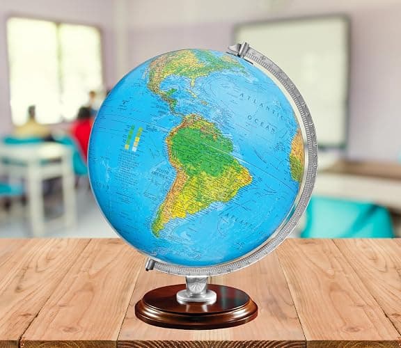 Standard Illuminated 12" Diameter Globe, USA Cartography with Walnut Finished Hardwood Base and Blue Ocean Globe Ball. A sleek walnut finished hardwood base and silver riser offer a perfect contrast to this beautiful geographic piece. When illuminated, this globe contains a vegetational map on the outside and political map on the inside that matches and shows through beautifully. thumbnail 5
