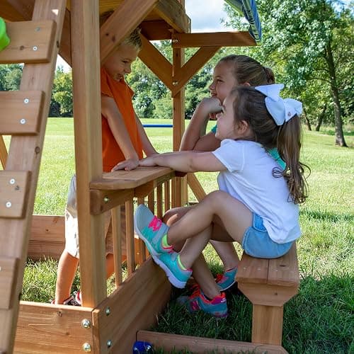 Backyard Discovery Beach Front Cedar Wood Swing Set with Wave Slide, Play Deck, Monkey Bars, Rock Wall Ladder, Shaded Picnic Area, Snack Bar, Belt Swings, Trapeze, Sandbox Area, Outdoor Playset thumbnail 5