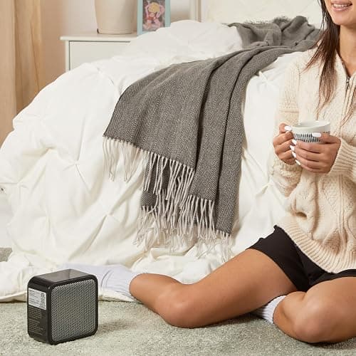 Amazon Basics Ceramic Space Heater, Mini Heater for Office Desk, Portable Tent Heater (Indoor Use), 500 W, With Tip-Over Protection, Lightweight (1.4 LBS), Black, 5.87”D x 3.15”W x 5.95”H thumbnail 2