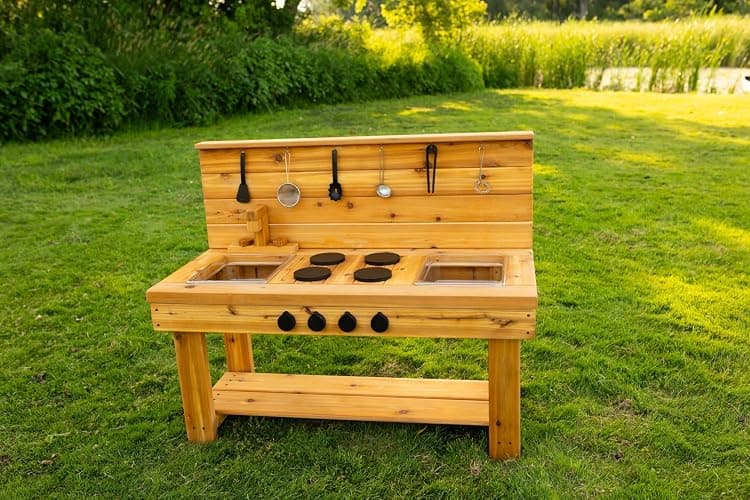 Noble Toys XL Cedar Outdoor Mud Kitchen Centered with Backsplash and Stovetop for Toddlers Kids | Pretend Play Table | Sensory Table | Outside Playset | Real Wooden Kitchens | Preschool Equipment thumbnail 7