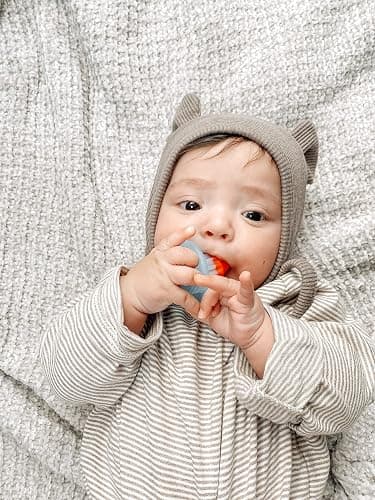 Itzy Ritzy Silicone Teensy Teether – Flexible, Soft & Hollow Baby Teething Toy with Easy-to-Hold Handle – Designed for Ages 3 Months and Up (Hero Pop) thumbnail 2