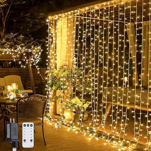 JMEXSUSS 300 LED Remote Control Christmas Curtain Lights, Plug in Fairy Curtain Lights Outdoor, Window Wall Hanging String Lights for Bedroom Backdrop Wedding Party Indoor Patio Xmas Decor, Warm White - Image 1
