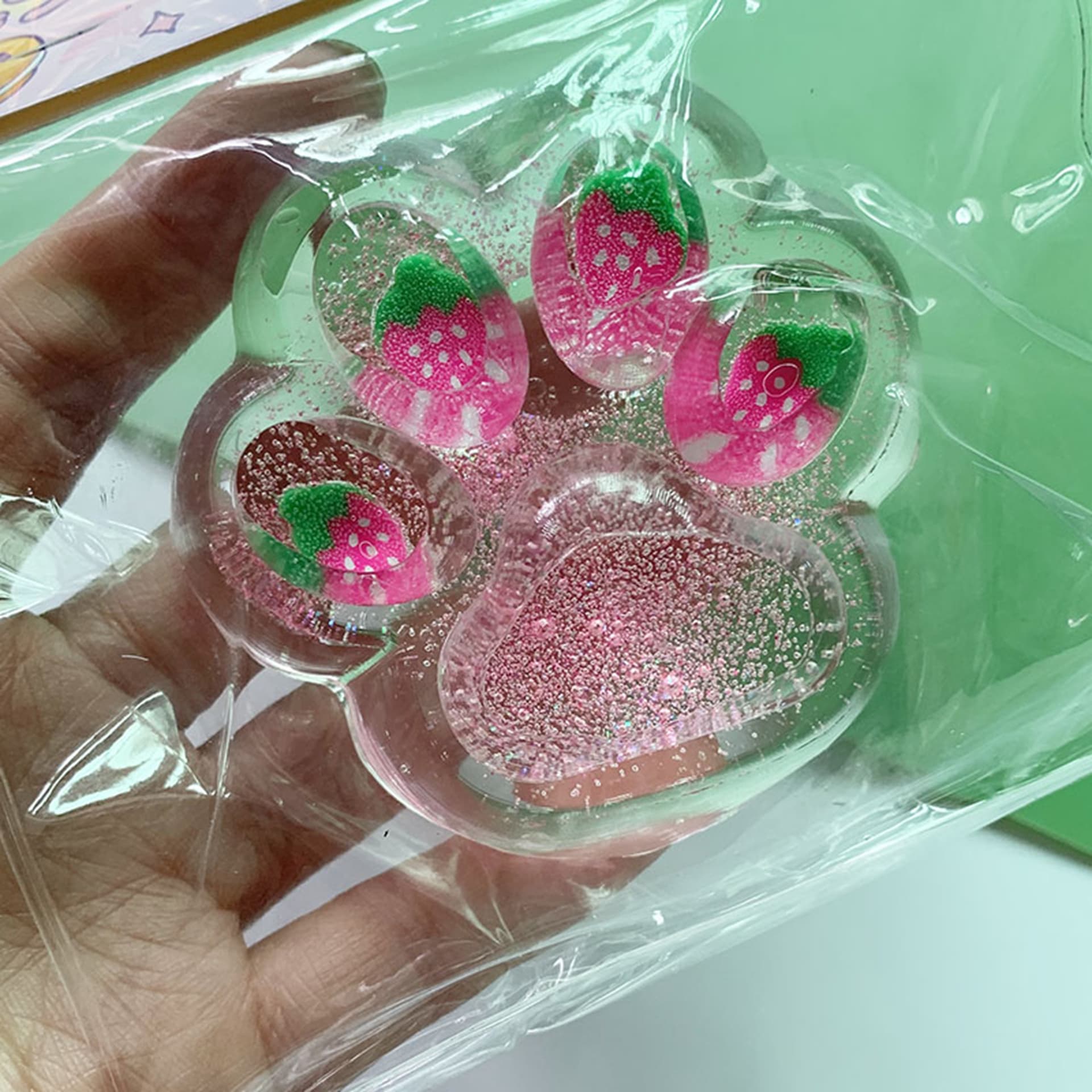 Strawberry Cat Paw Fidget Toy - Slow-Rising Jelly Relax Toy with Glitter, Pink & Green Sensory Design, Durable Plastic for Youngsters & Adults, Fun Novelty Gift, Novelty Gift Item | Glittery Toy | Vibrant Colors - Image 1