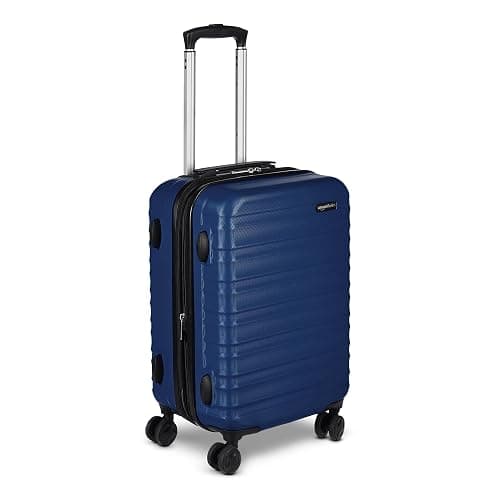 Amazon Basics 21" Hardside Carry-On Luggage, Hardshell Suitcase With Wheels, Expandable For Up to 25% More Space, With Scratch-Resistant Surface, Four Multi-directional Wheels, Navy Blue - Image 1